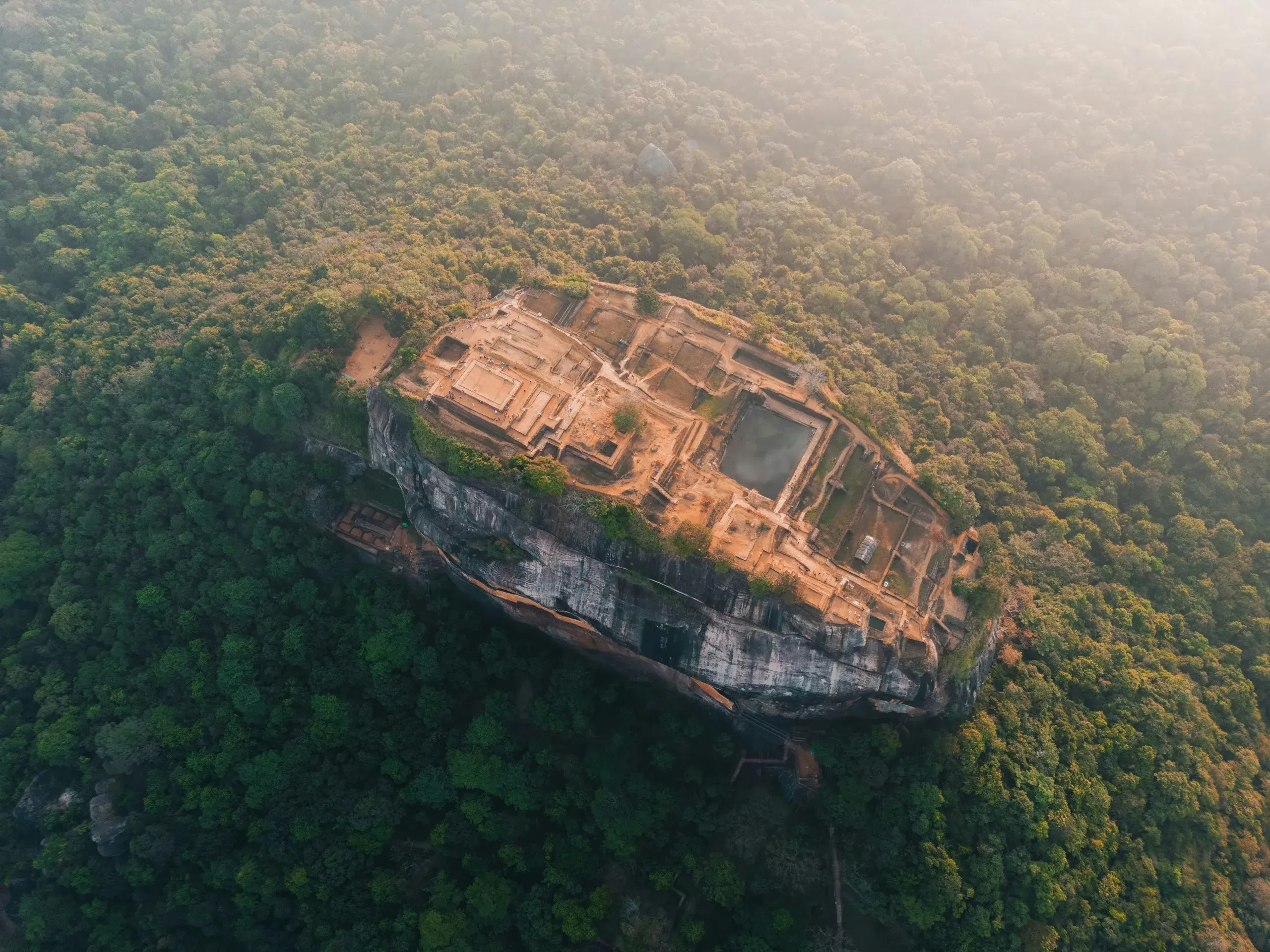 Sigiriya rock fortress - golden hour, climbers on the stair